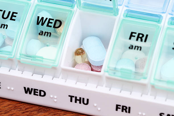 istock Medicine pill box daily planner with medicines 514772973
