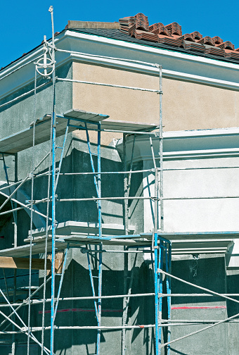 Stucco work on office building at construction site in California