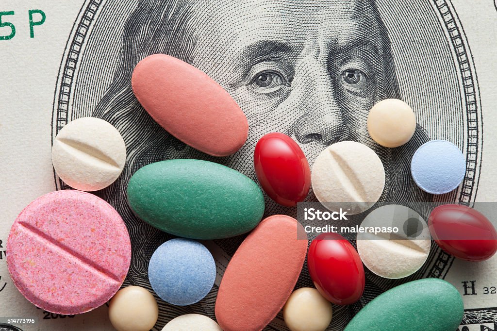 Cost of Healthcare. Pills on US dollars. Pills on US dollars. Medicine Stock Photo
