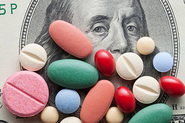Cost of Healthcare. Pills on US dollars. stock photo