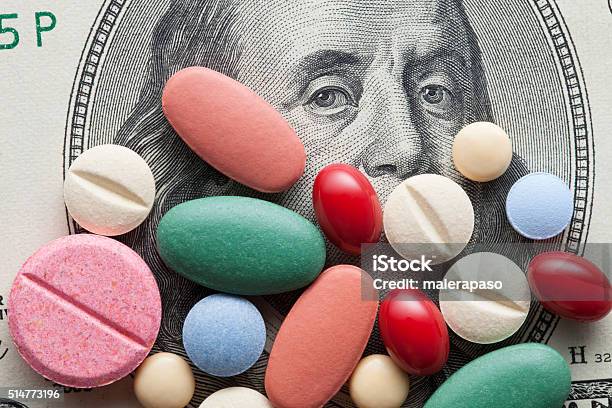 Cost Of Healthcare Pills On Us Dollars Stock Photo - Download Image Now - Medicine, Healthcare And Medicine, Prescription Medicine