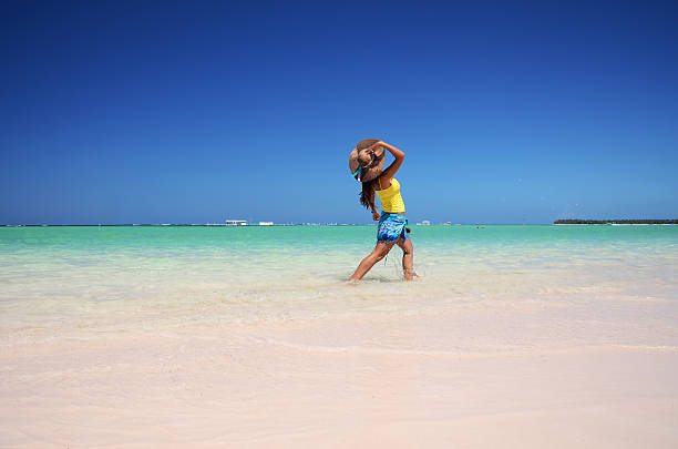 istock Young woman relaxing on tropical carribean beach 514774322