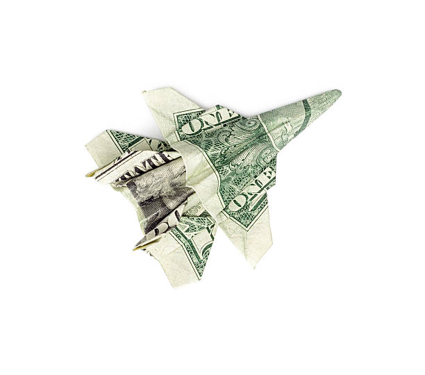 istock Dollar origami fighter jet isolated 514774868