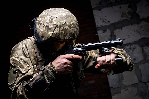 istock Soldier in helmet and tactical mask on face with gun 514775010