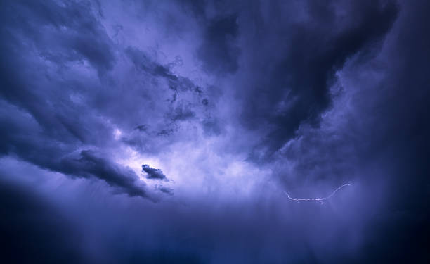 istock Storm clouds are illuminated from within a flash of lightning. 514775363