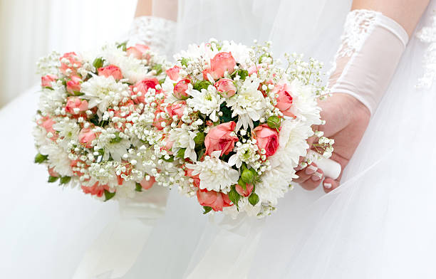 istock Wedding bunch of flowers in hands  the bride 514775449