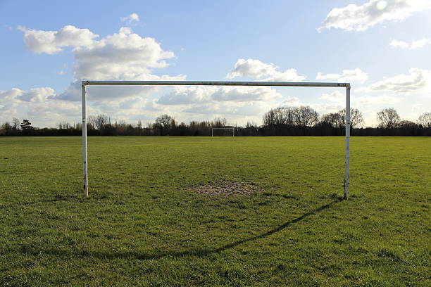 istock Goal Posts On A Field In The Sun 514776678