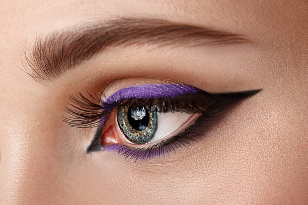 istock closeup eye with makeup - arrow black and lilac 514777463