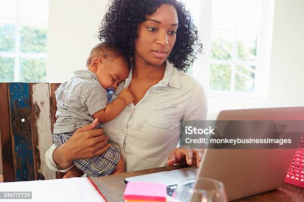 Mother With Baby Working In Office At Home Stock Photo - Download Image Now - Mother, Working Mother, Baby - Human Age