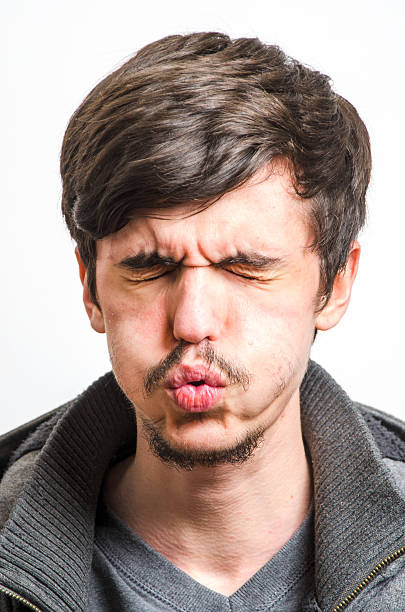 istock Grimacing Man in Pain 514778102