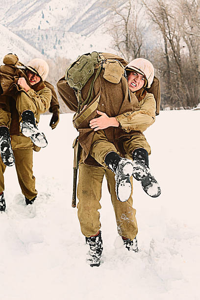 WWII Soldiers Carrying the Wounded stock photo