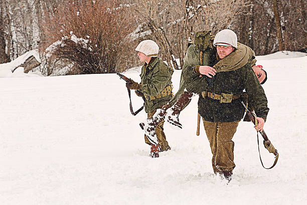 istock WWII Soldiers Carrying the Wounded 514779620