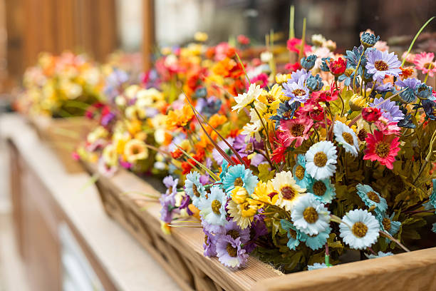 istock Artificial flowers in the box outside the window 514780676