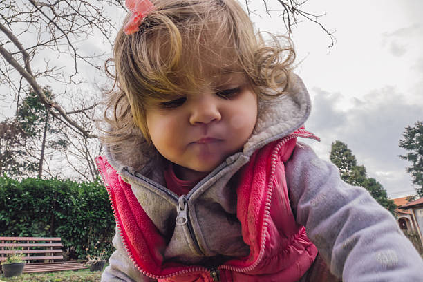 istock Baby girl playing in the backyard 514783506