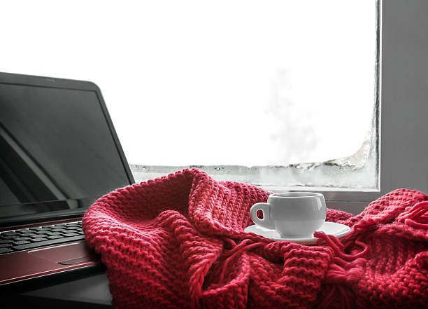 istock cup of hot coffee and a laptop for work 514783882