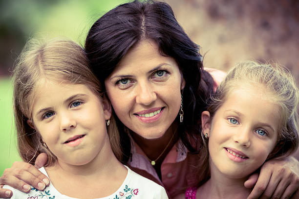 istock Mature woman posing with her daughters 514785396