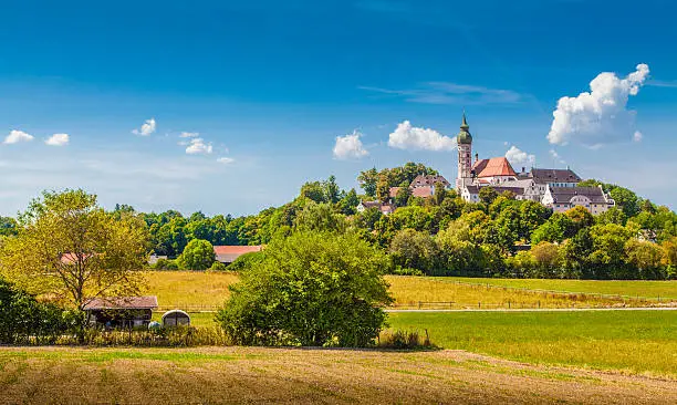 Beautiful view of famous Andechs Abbey on top of a hill in summer, district of Starnberg, Upper Bavaria, Germany.