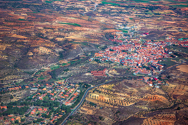 вид с воздуха на небольшой город с местом для копии - satellite view topography aerial view mid air стоковые фото и изображения