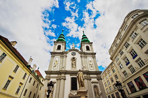 Monument to the Franz Joseph Haydn in the background of Sankt Mariahilf/Barnabites Church, Vienna, Austria