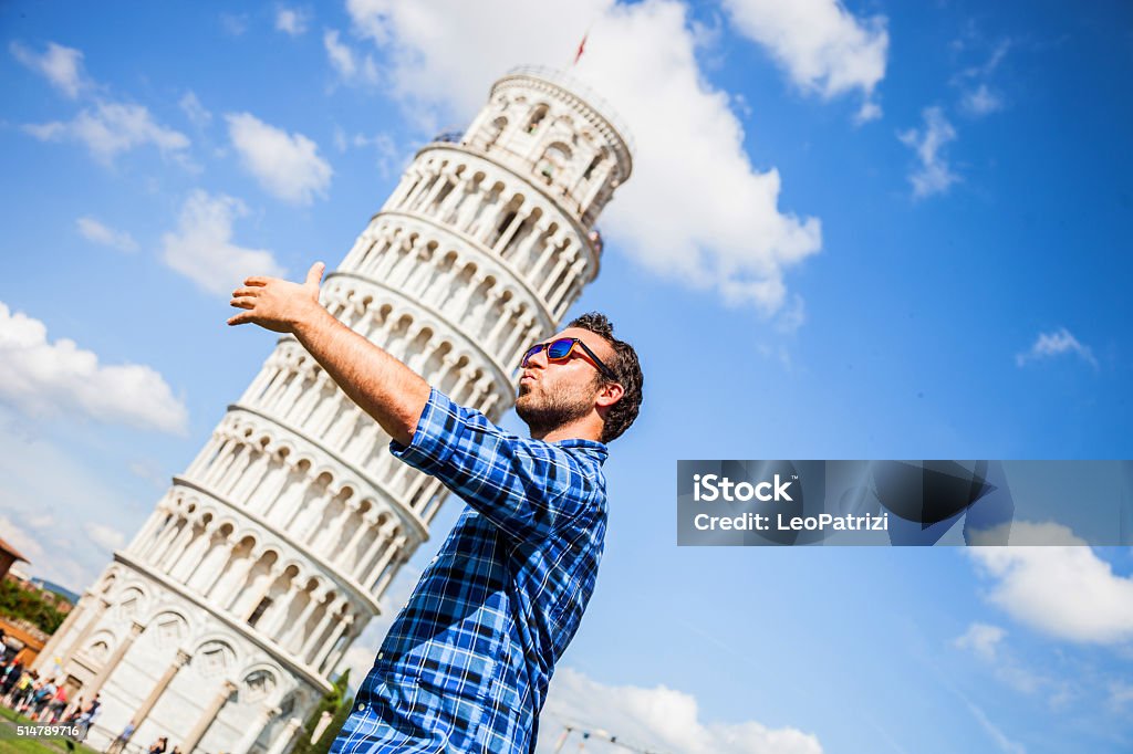 Young tourist having fun in Pisa Young tourist having fun in Pisa close to the leaning tower. Leaning Tower of Pisa Stock Photo