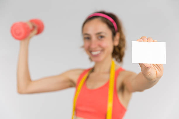 istock Happy weight loss woman showing empty card 514790594