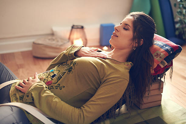 istock Attractive mixed race woman doing restorative yoga 514790652