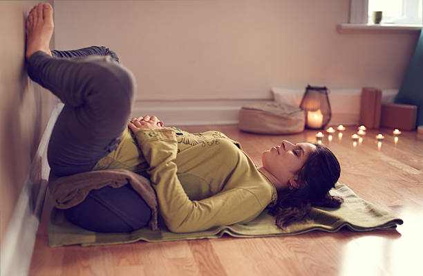 istock Attractive mixed race woman doing restorative yoga 514790762