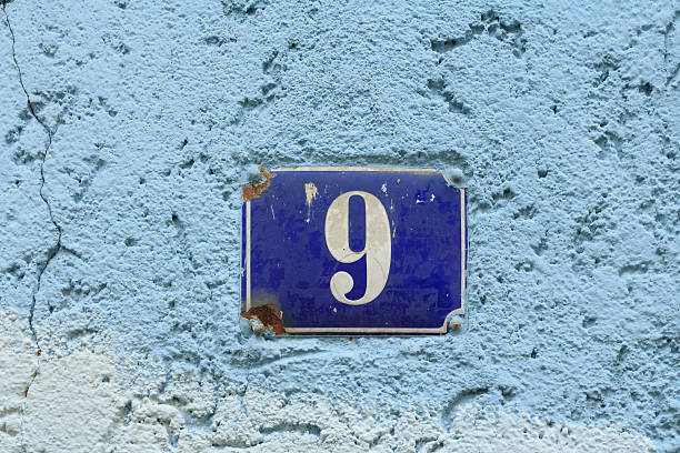 istock House number nine on an old blue enamel sign 514791870