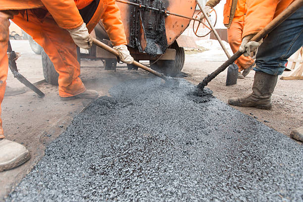 istock Road workers laid asphalt, repairing the road 514792816