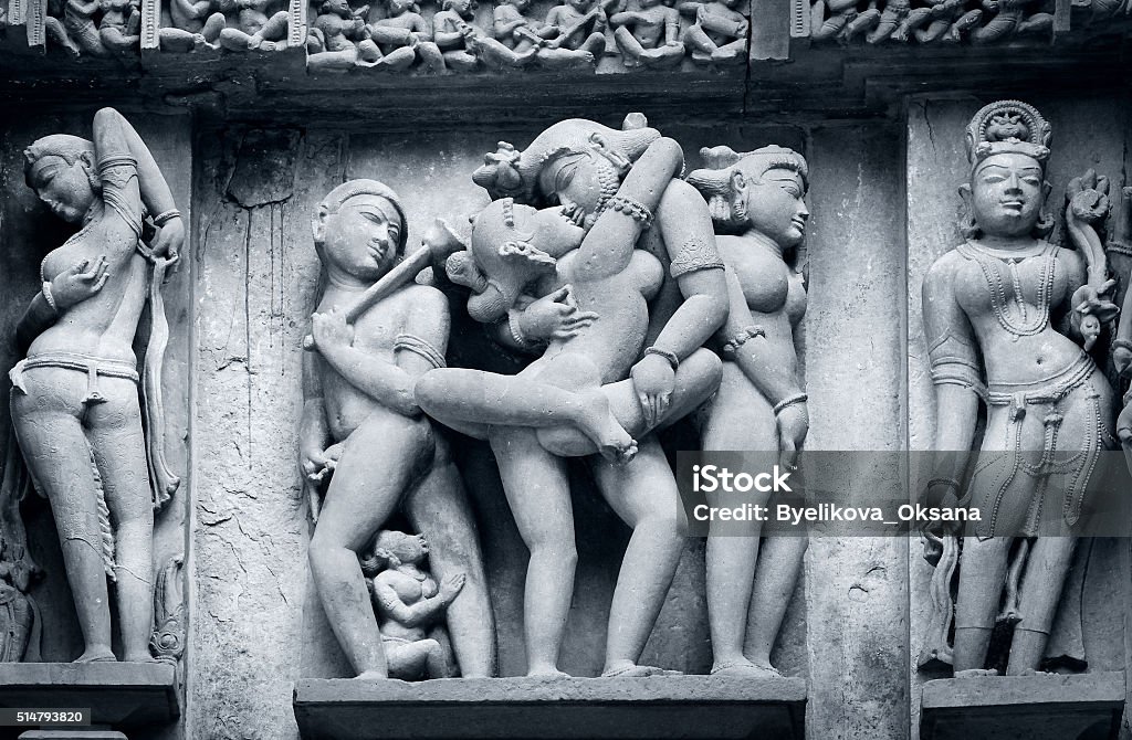 Stone carved erotic bas-relief in Hindu temple in Khajuraho, Ind Stone carved erotic bas-relief in Hindu temple in Khajuraho, India. Unesco World Heritage Site Sexual Issues Stock Photo