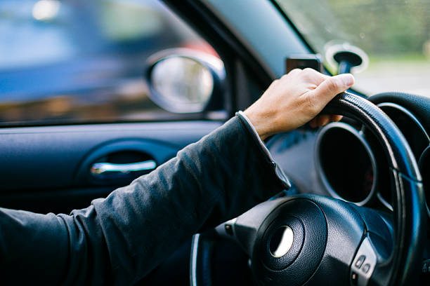 istock Man's hand on the steering wheel 514795610