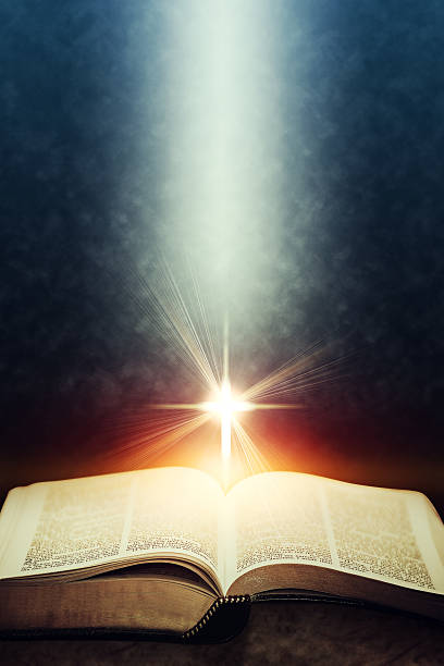 Light flares illuminating the Holy Bible Light flares illuminating the Holy Bible. methodist stock pictures, royalty-free photos & images