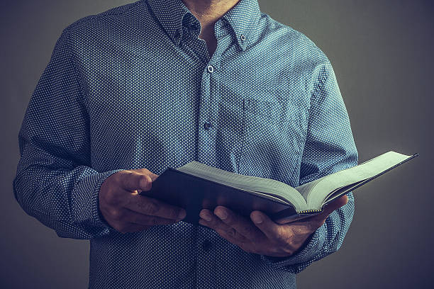 istock Pastor or preacher with the Bible on his hands 514796100
