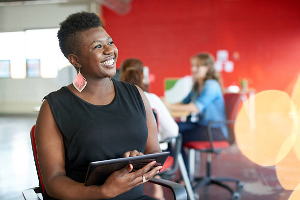 istock Confident female designer working on a digital tablet in red 514796238