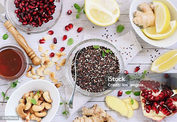 Quinoa Salad And Honeylemon Dressing Ingredients Stock Photo - Download Image Now - Pomegranate, Quinoa, Tabbouleh