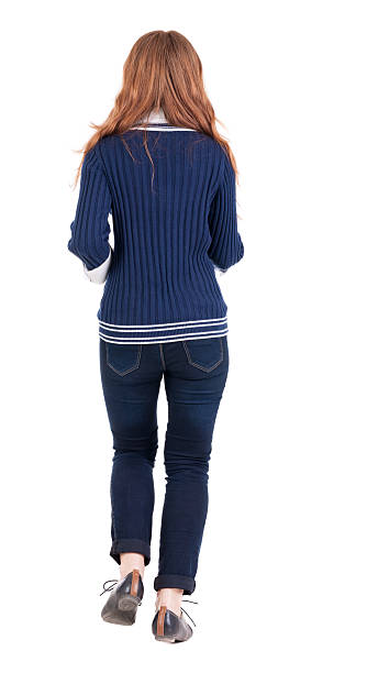 istock back view of running  woman  in  jeans 514798563