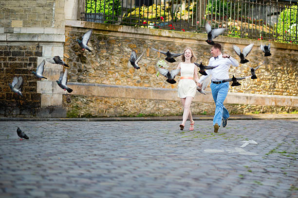 istock Happy just married couple jumping 514799089