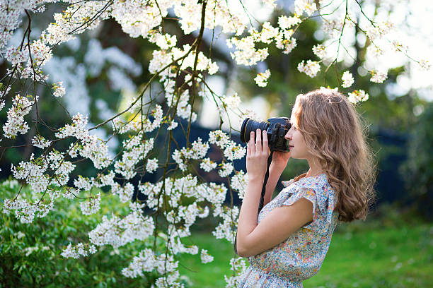 istock Beautiful woman in blooming cherry garden 514799549