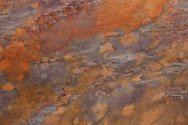 istock Pattern of a stone plate in orange, ocher, silver, purple 514799611