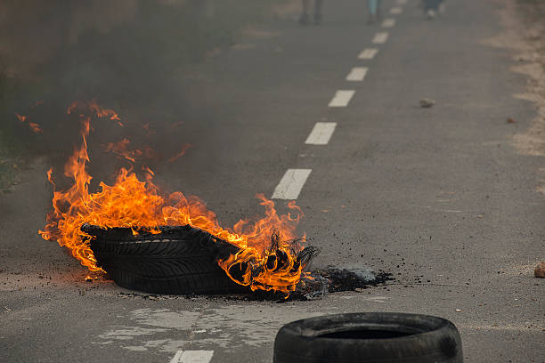 istock Burning tires in a riot 514800561