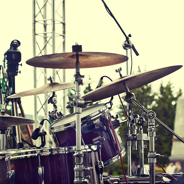 Close-up of a drumstick on drum kit at a recording studio