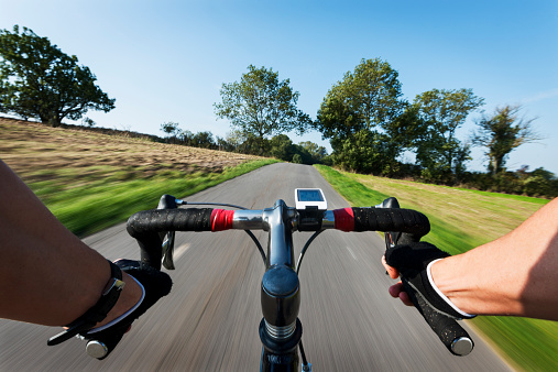 Rider point of view of a cyclist speeding along a road in Denmark.