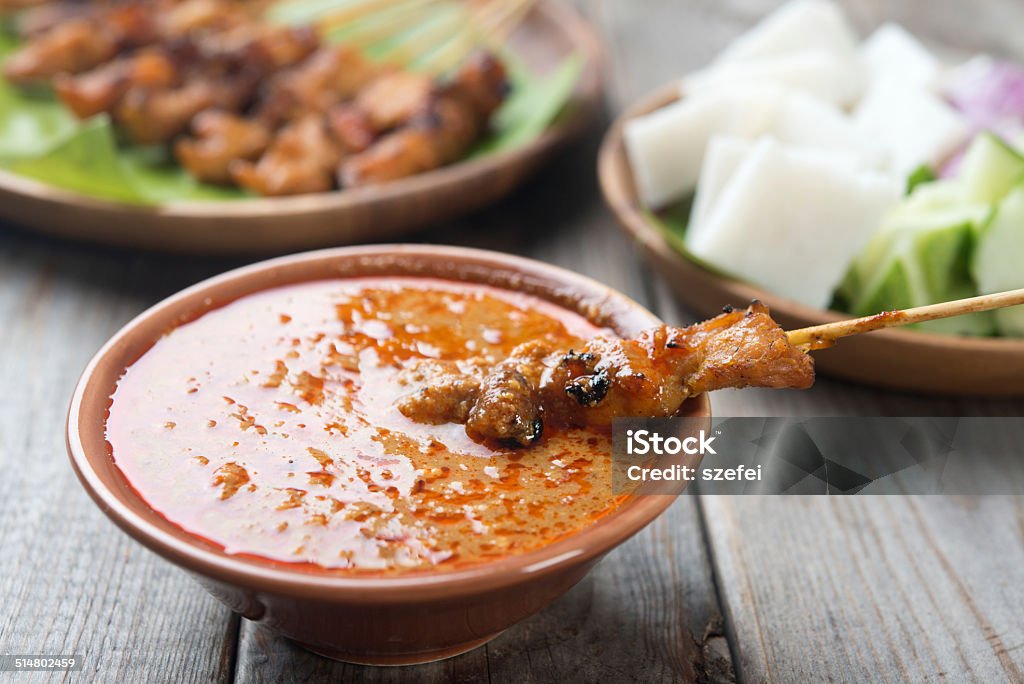 Delicious chicken sate Malaysian chicken sate with delicious peanut sauce, one of famous local dishes. Adulation Stock Photo