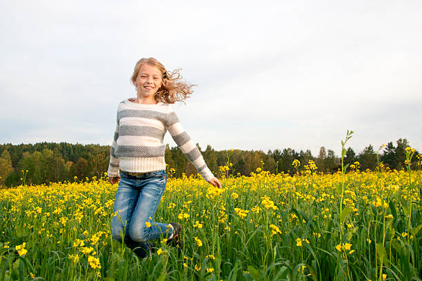istock jumping happy girl outdoor 514826183