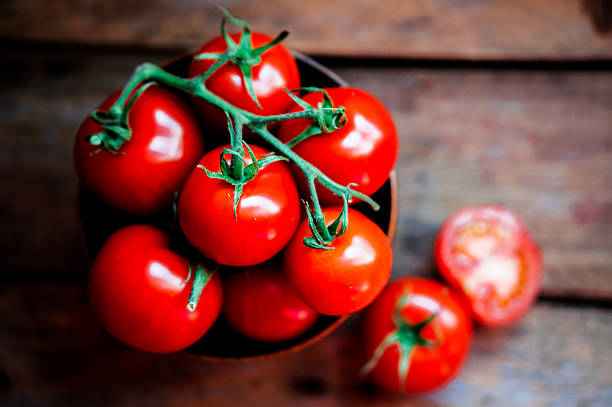 istock Tomatoes in the basket on wooden background 514826238
