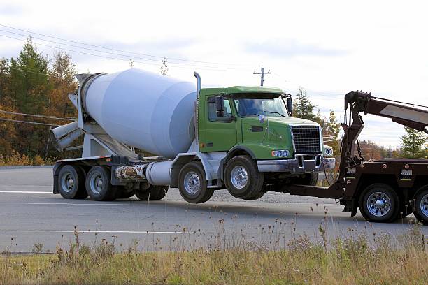 istock Cement truck being towed 514827690