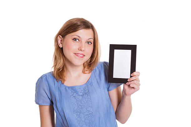 istock beautiful girl holding frame 514827981