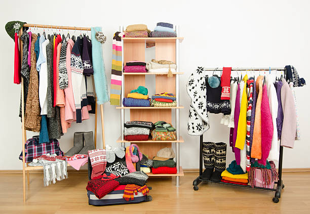 istock Wardrobe with clothes nicely arranged and a full luggage. 514828341