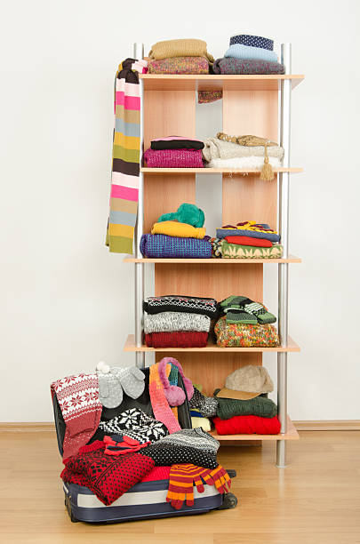 istock Wardrobe with clothes nicely arranged and a full luggage. 514828349
