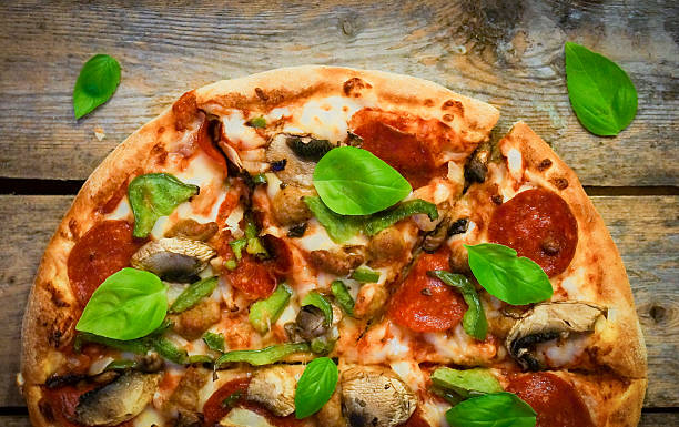 istock Sliced home made pepperoni pizza on wooden rustic background 514831744